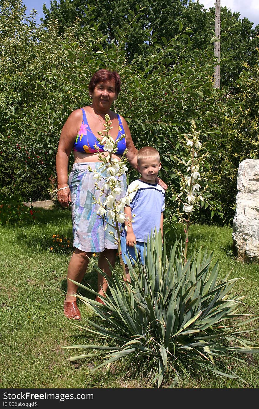 Grandmother and grandson in garden