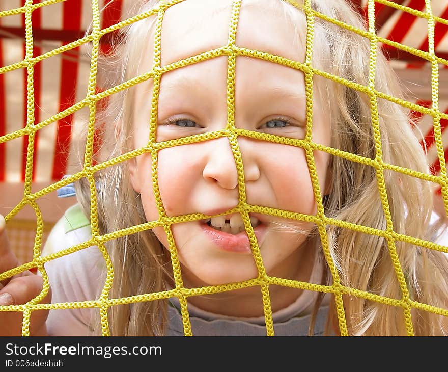 Child behind the grid. Child behind the grid