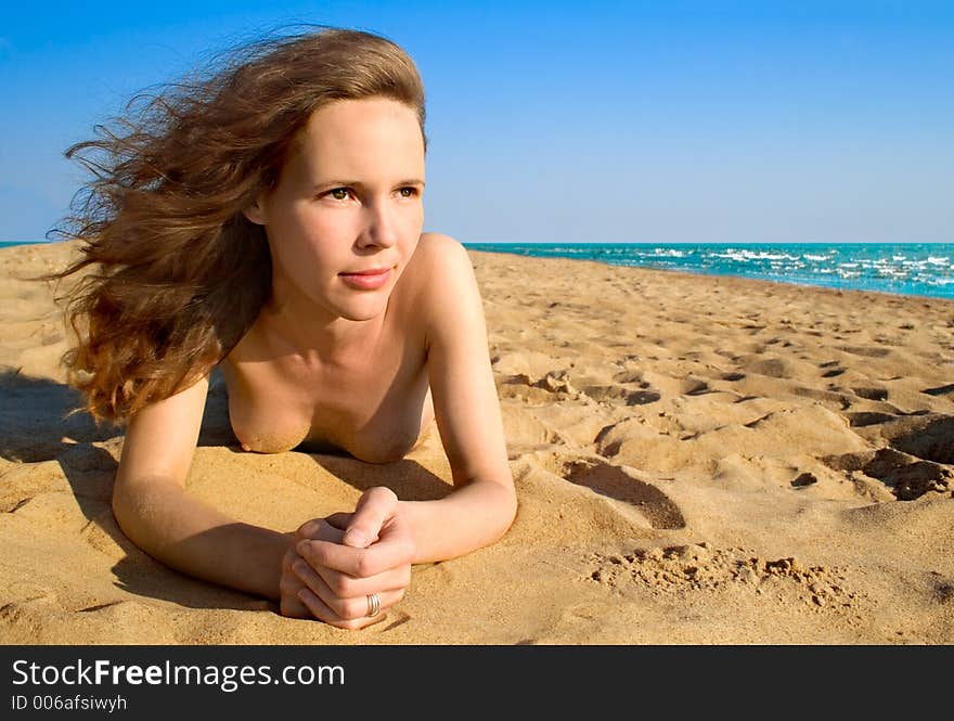 Girl laying on a beach-1