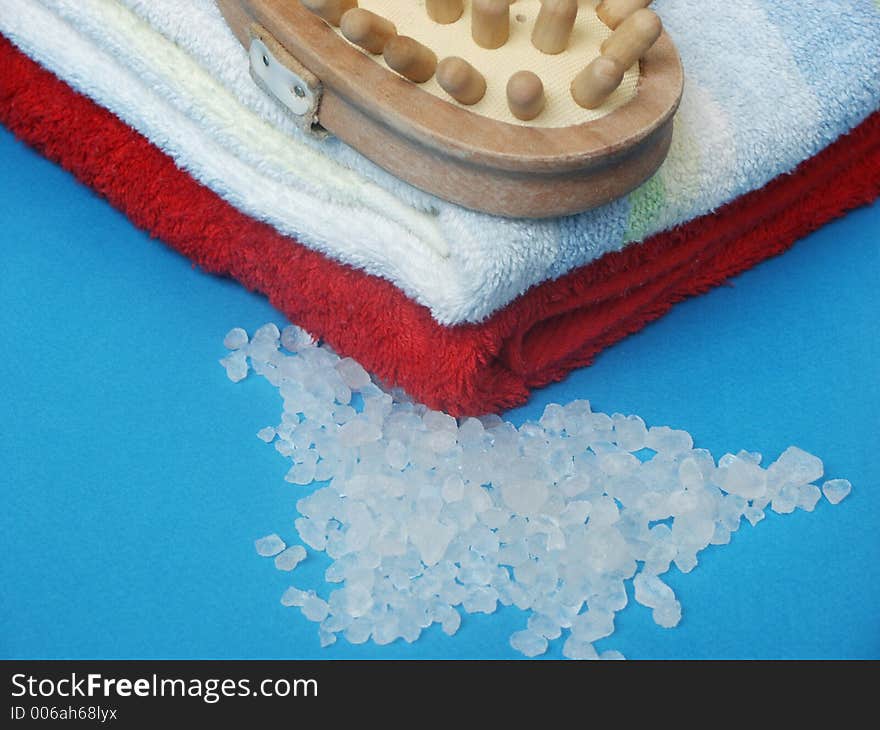 Two towels, sea salt and massage brush. Two towels, sea salt and massage brush