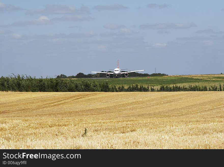 Harvest - aeroplane on runway behind 05