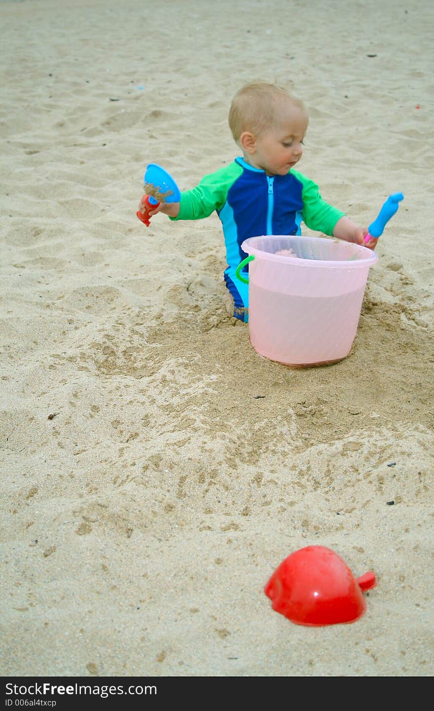 Small child exploring a beach in Cornwall. Small child exploring a beach in Cornwall.