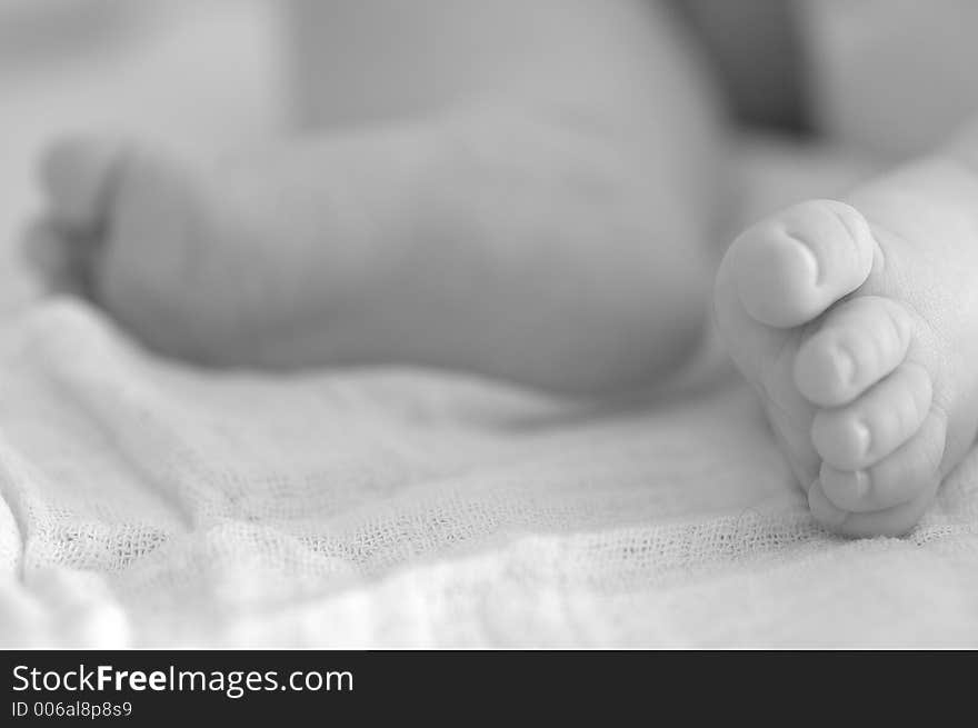 Sleeping babys feet black/white. Sleeping babys feet black/white