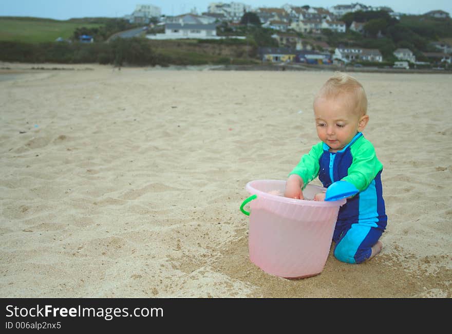 Small child exploring a beach in Cornwall. Small child exploring a beach in Cornwall.