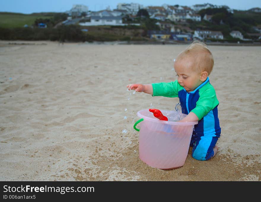 Small child exploring a beach in Cornwall. Small child exploring a beach in Cornwall.