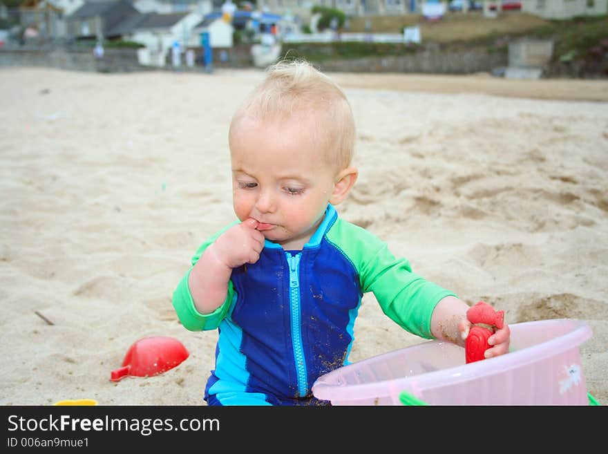 Small child exploring a beach in Cornwall. Small child exploring a beach in Cornwall.