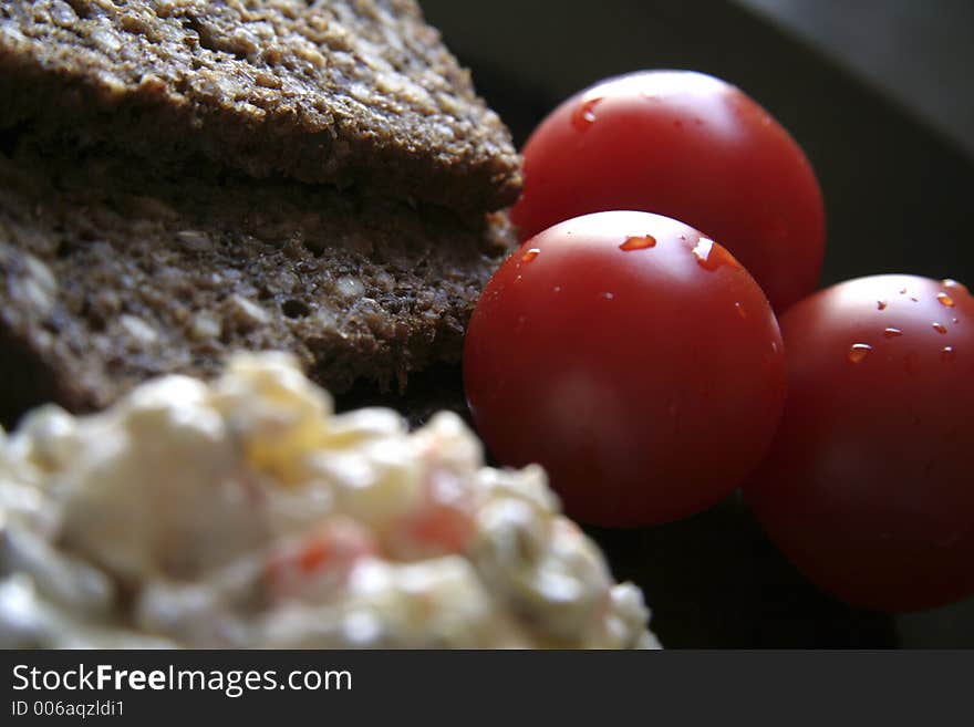 Picture of fresh tomatoes, brown bread and salad. Picture of fresh tomatoes, brown bread and salad