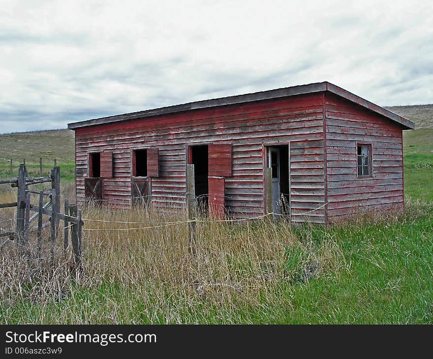 This image of the abandoned stable and fence was taken in Kalispell, MT.