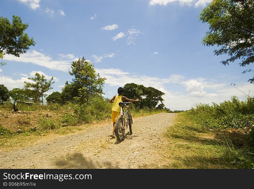 Boy walks home bike after play. Boy walks home bike after play