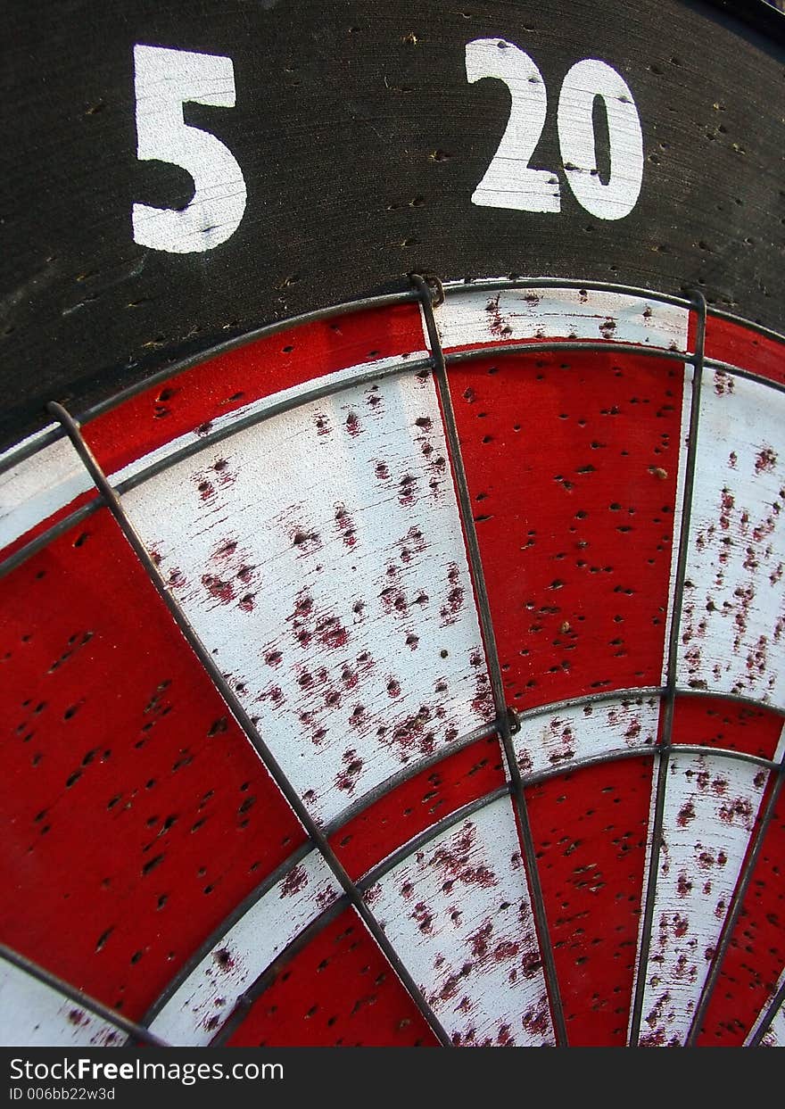 A well used dart board. A well used dart board