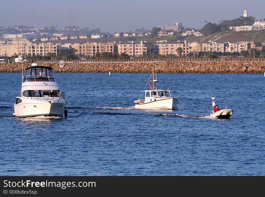 Three boats in a channel