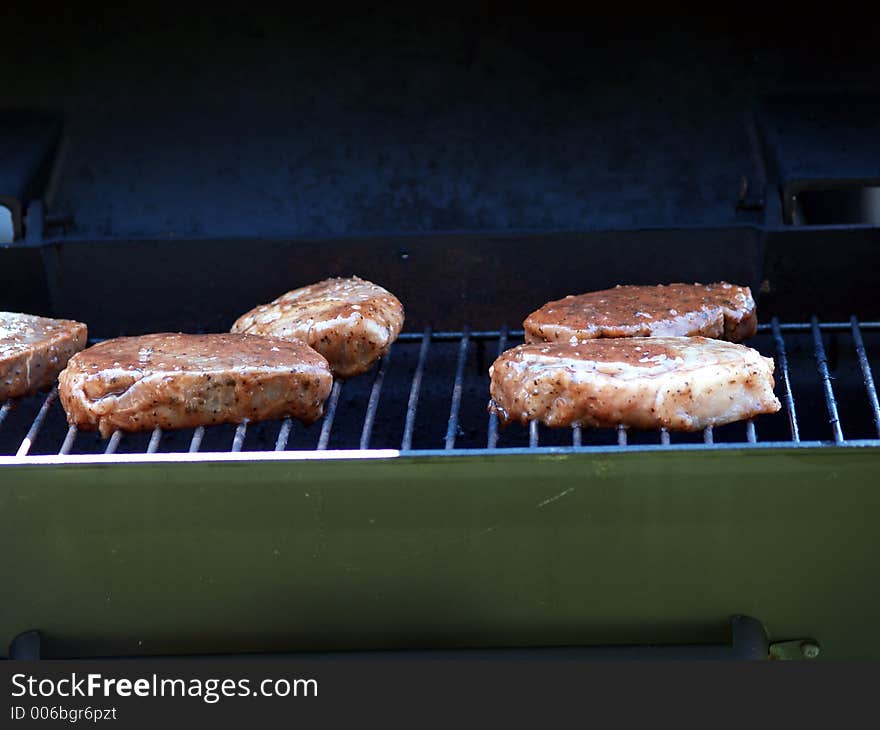 Steaks just started cooking on the grill.  Don't they look delicious?. Steaks just started cooking on the grill.  Don't they look delicious?