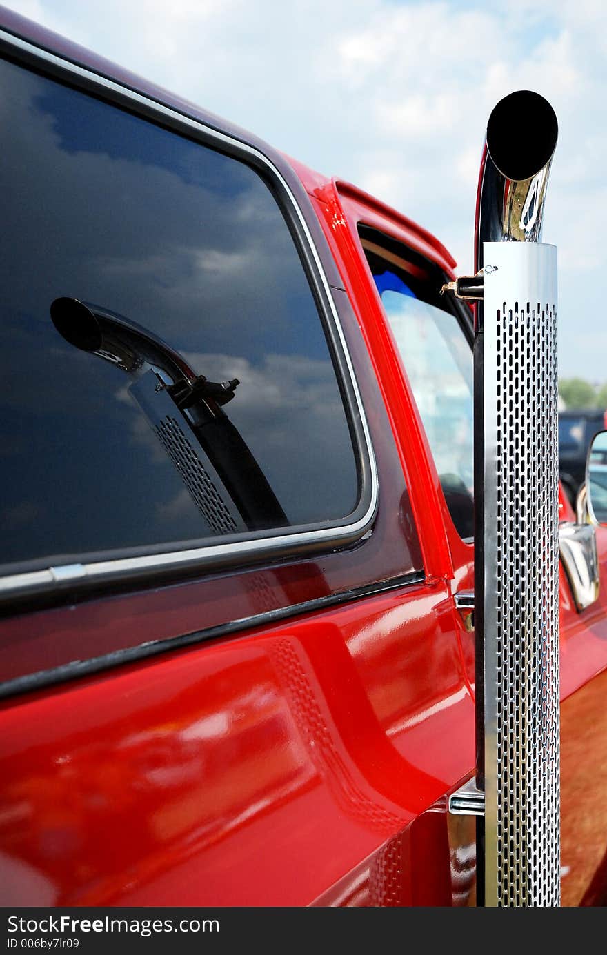 Exhaust pipe on red car