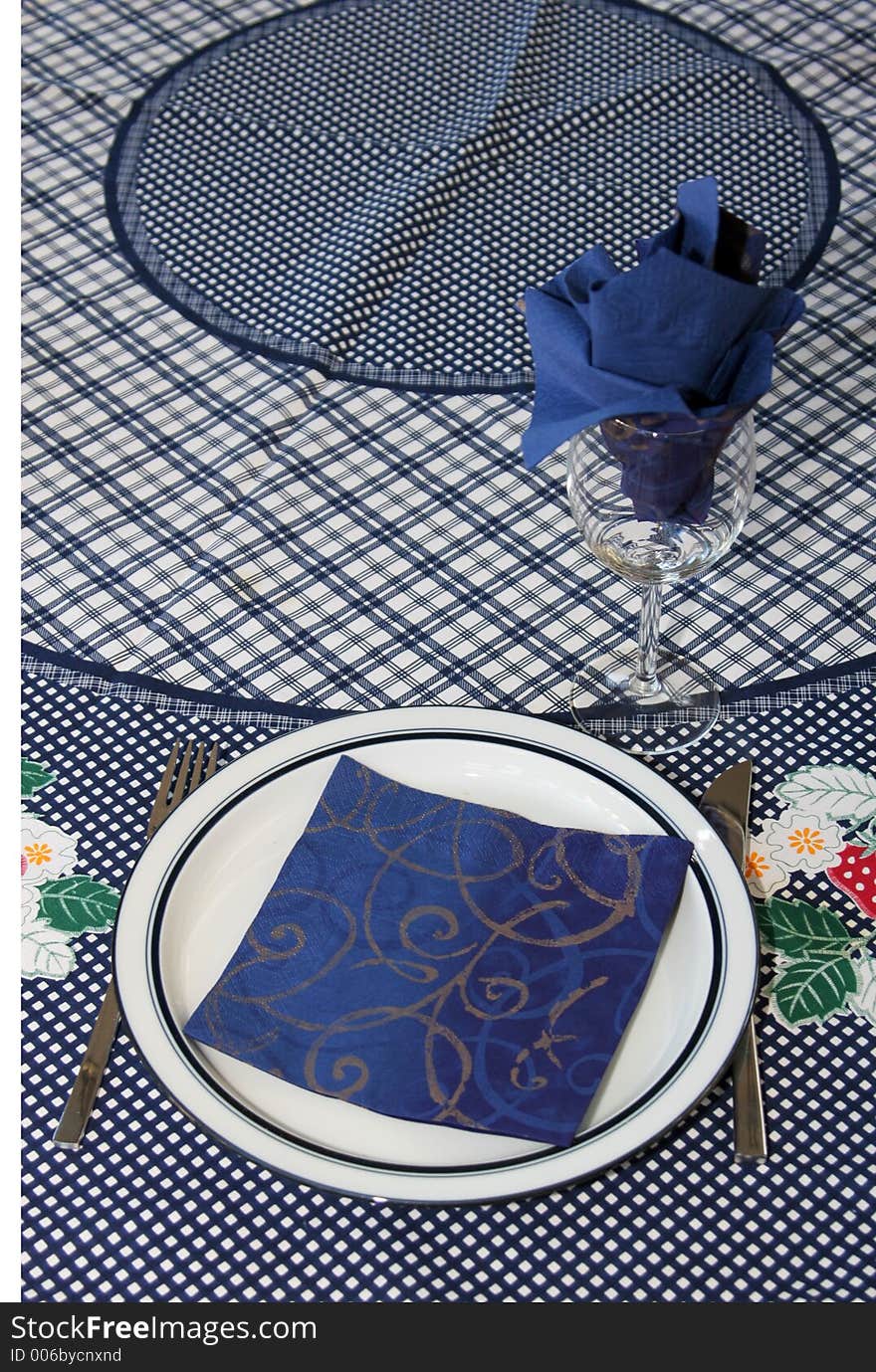 Dinner plate and glass set up for one to din, blue theme. Dinner plate and glass set up for one to din, blue theme