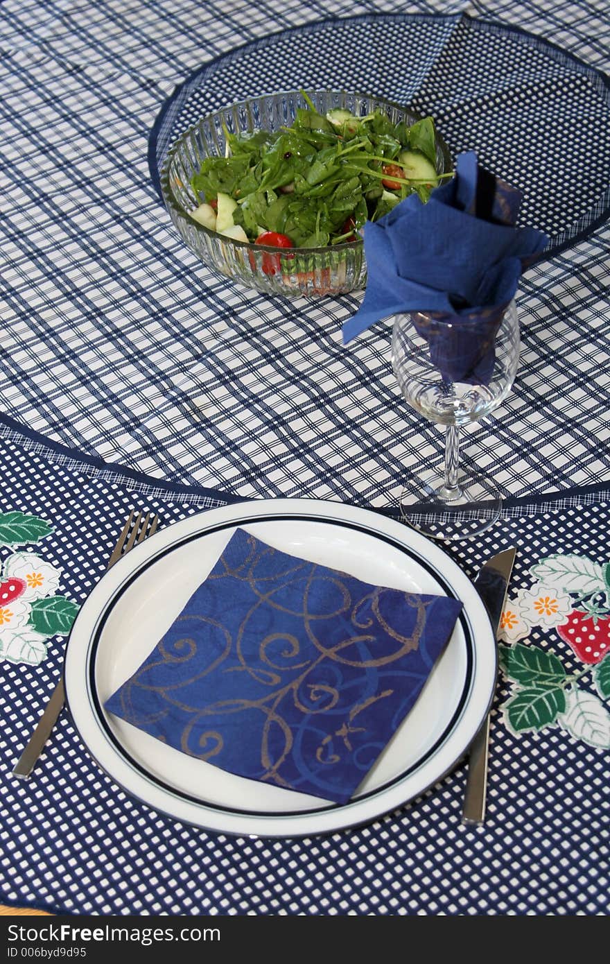 Dinner plate and glass set up for one to din, blue theme. Dinner plate and glass set up for one to din, blue theme