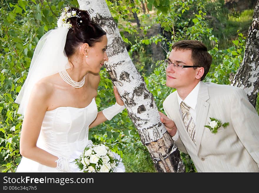 Newlywedses on walk in park. Newlywedses on walk in park