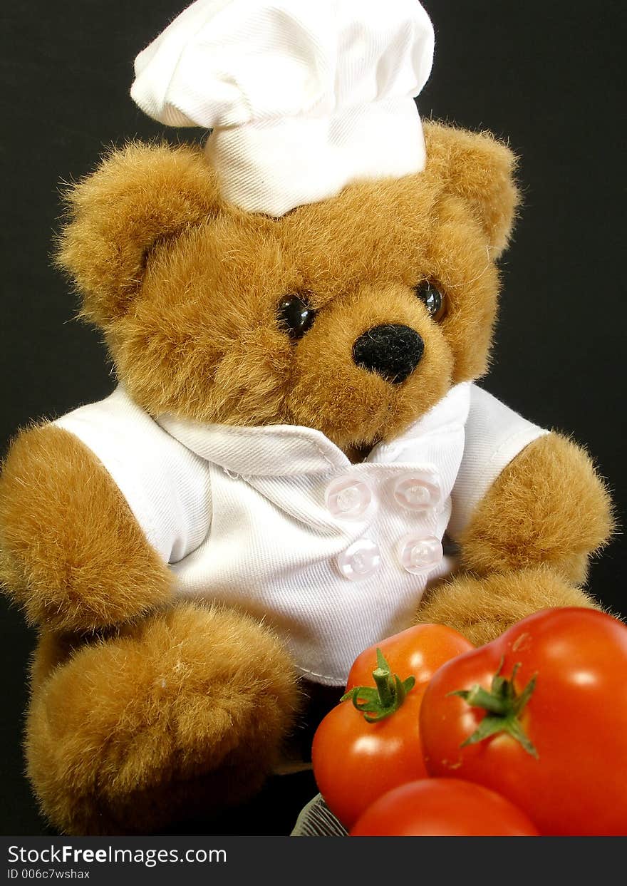 Teddy bear got some tomatoes from the garden and is wondering what to do with them. Teddy bear got some tomatoes from the garden and is wondering what to do with them