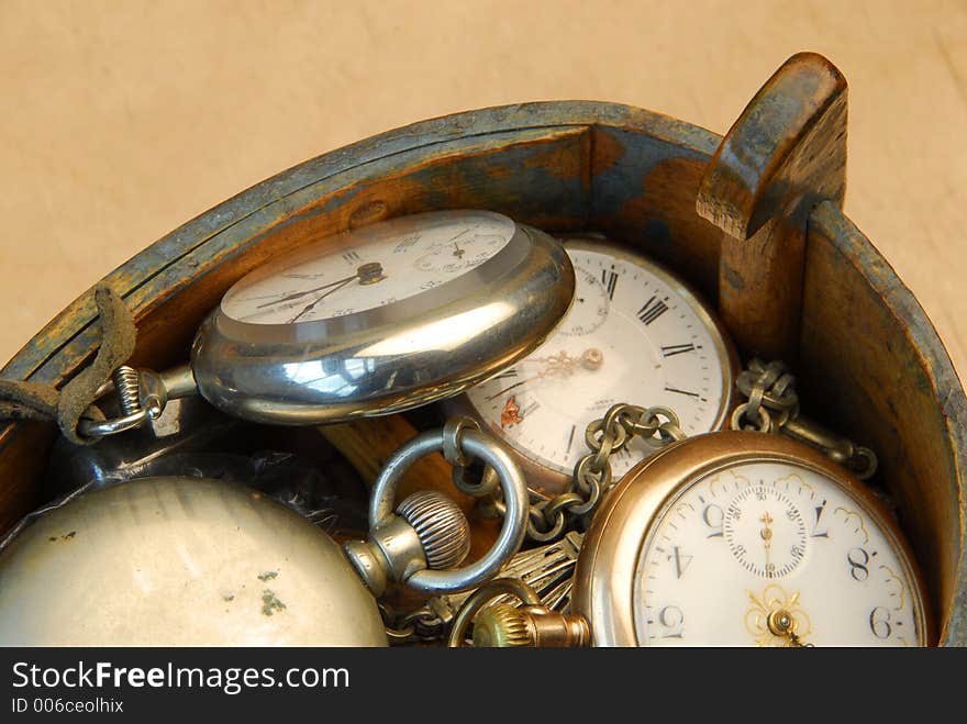 Wooden box with old pocket watches