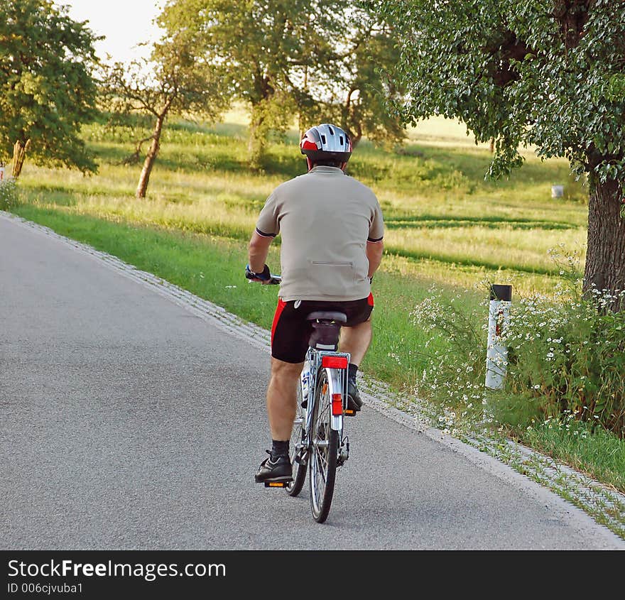 A senior man drive with his bycicle. A senior man drive with his bycicle