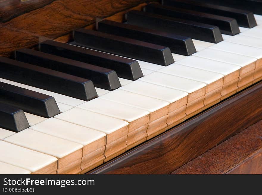 Details of an antique square piano keyboard. Details of an antique square piano keyboard