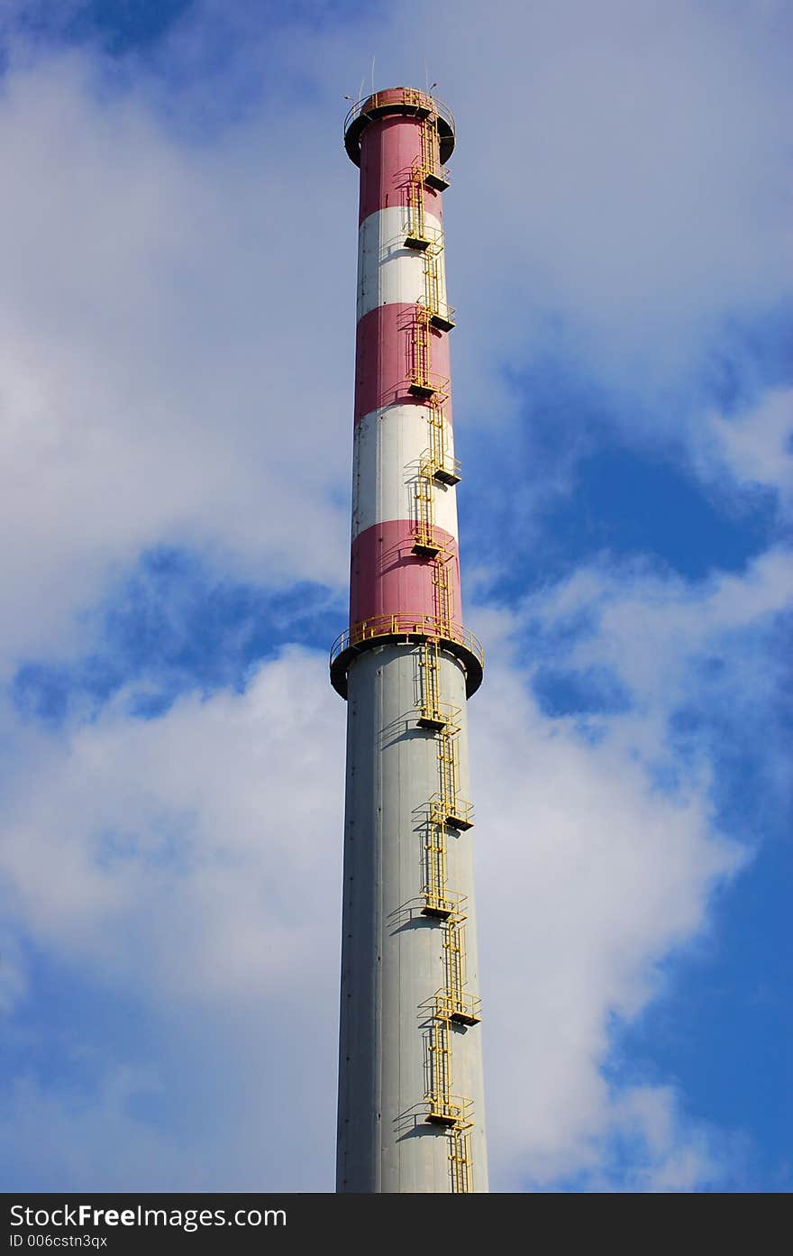 Chimney of a factory and blue sky