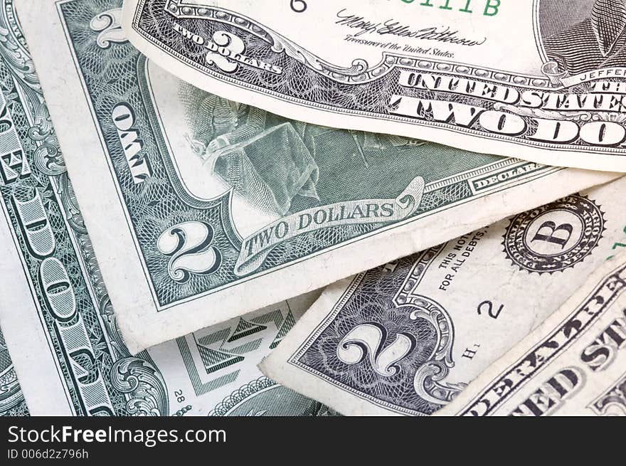 Pile of two dollar bills (and a one dollar bill) - horizontal format. Pile of two dollar bills (and a one dollar bill) - horizontal format