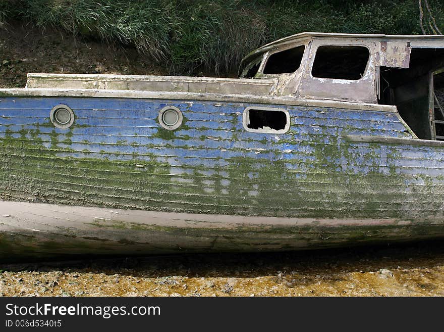 A sunken ship wrecked boat on a tidal sea river. A sunken ship wrecked boat on a tidal sea river