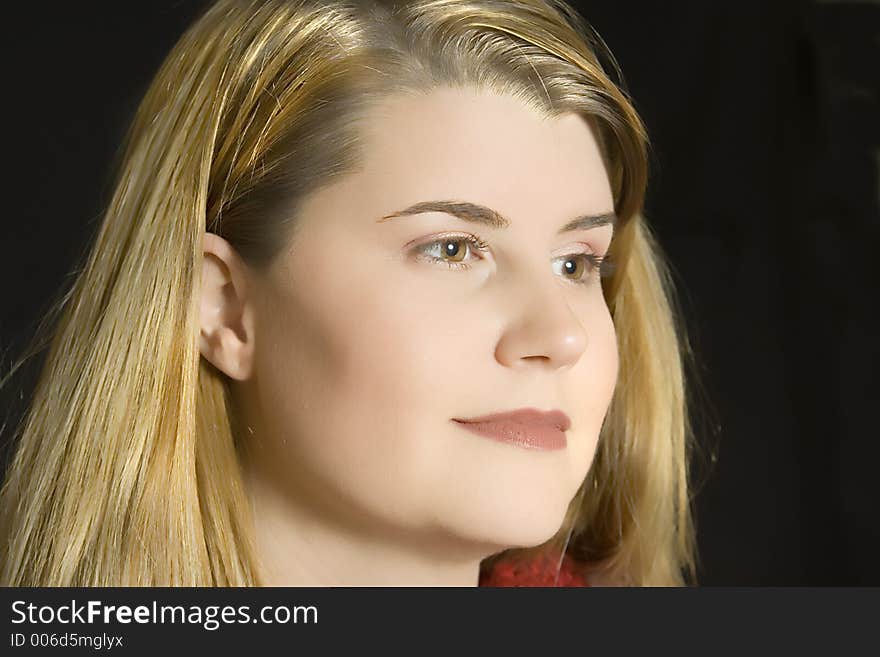 A young lady poses for a portrait that highlights her smooth skin. A young lady poses for a portrait that highlights her smooth skin.