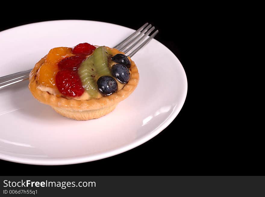 Fruit tart on white plate. Fruit tart on white plate