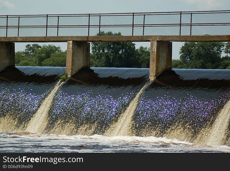 Photograph of a waterfall at a community lake. Photograph of a waterfall at a community lake.