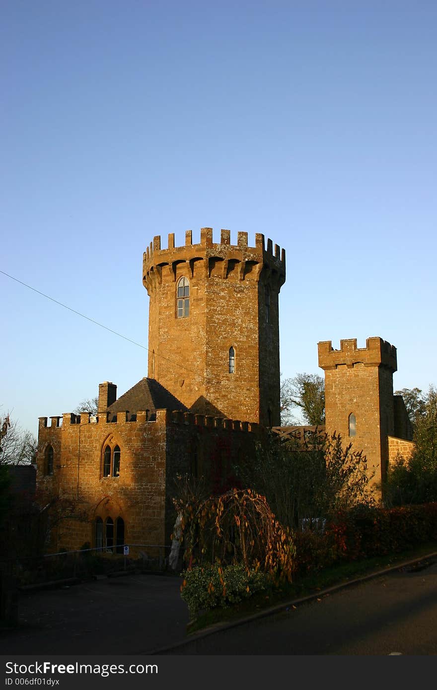 Castle at sunset against blue sky. Castle at sunset against blue sky