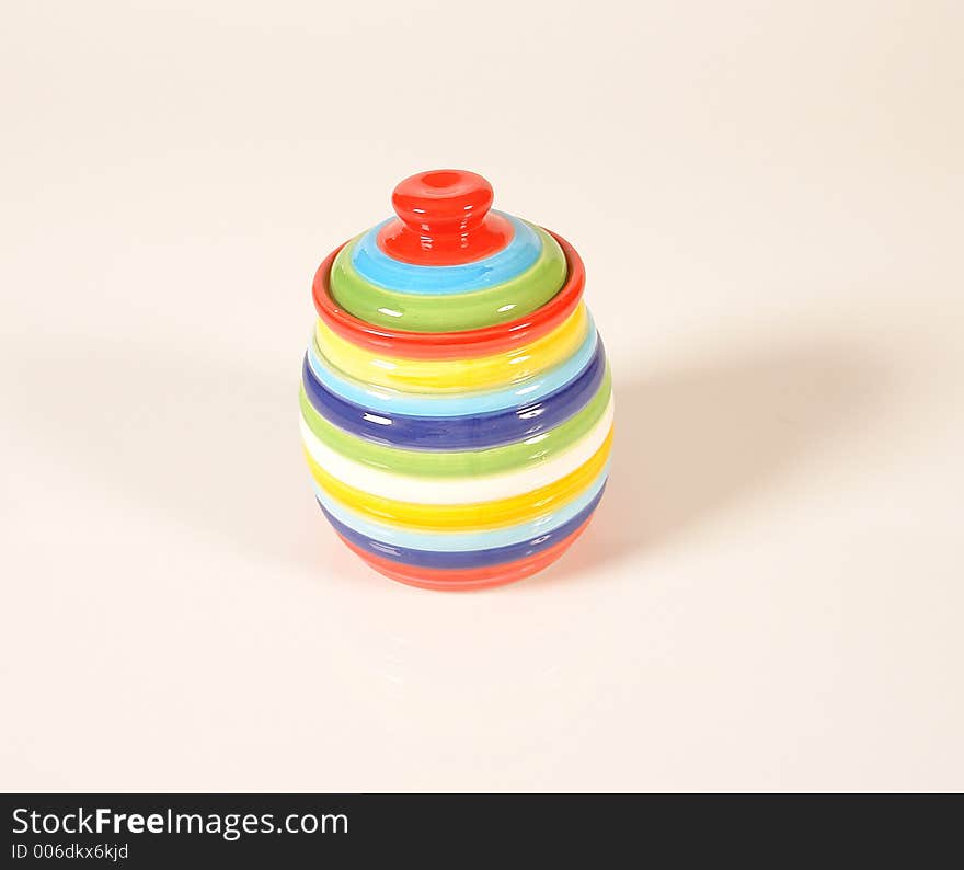 Multicolored jam or honey jar on isolated background. Multicolored jam or honey jar on isolated background