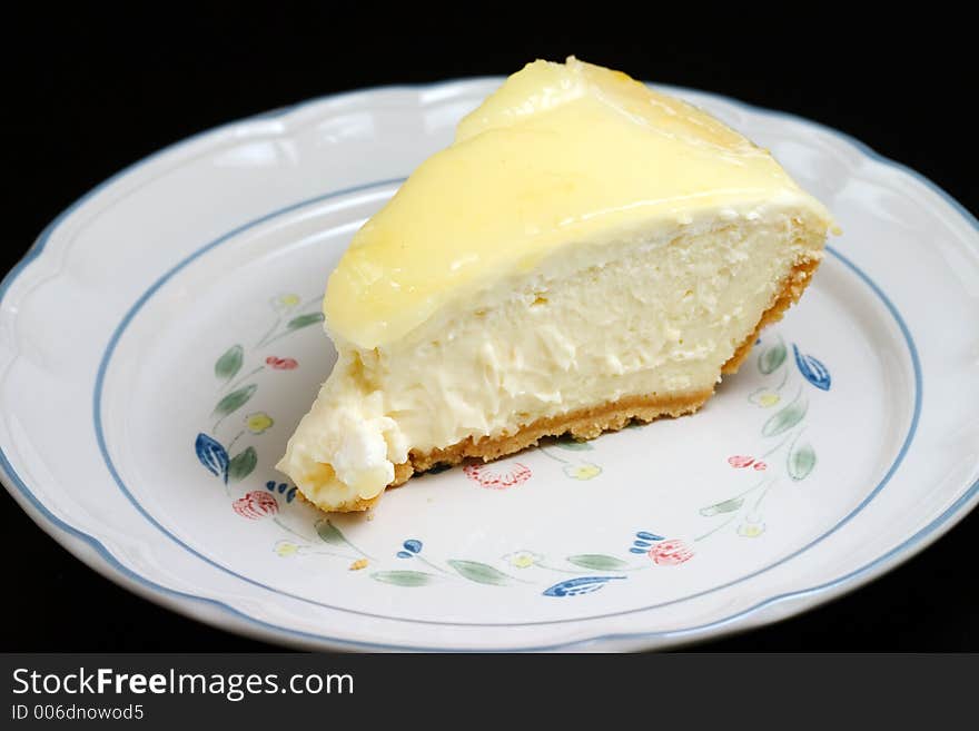 Lemon glazed cheesecake on a plate