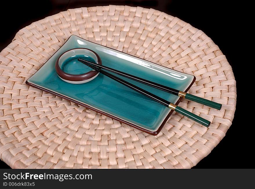 Plate, Dipping Bowl And Chop Sticks On Mat