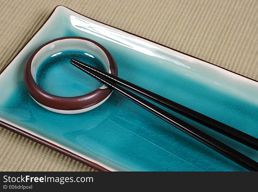 Plate, Dipping Bowl And Chop Sticks On Green Mat 2