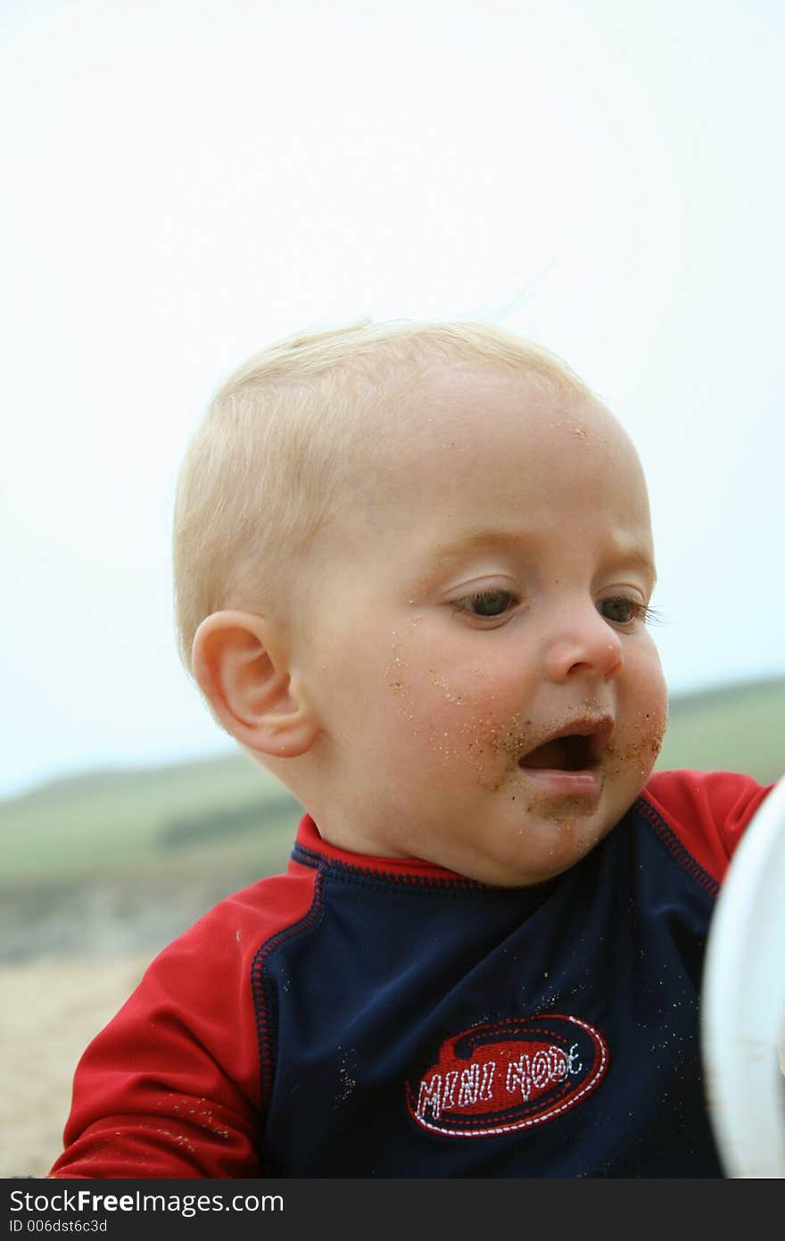 Small child exploring a beach in Cornwall. Small child exploring a beach in Cornwall.