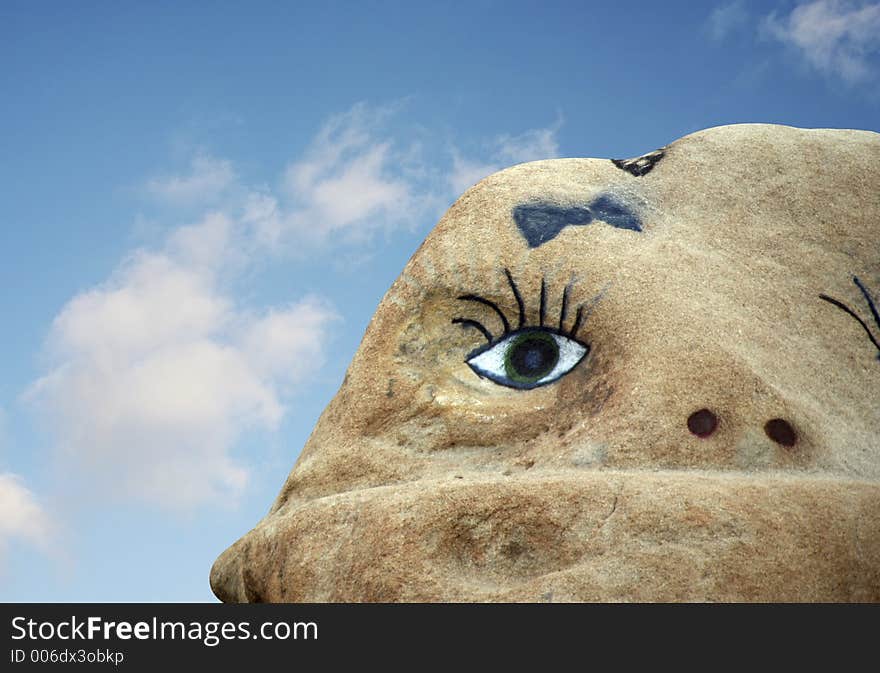 A face painted on a rock. A face painted on a rock