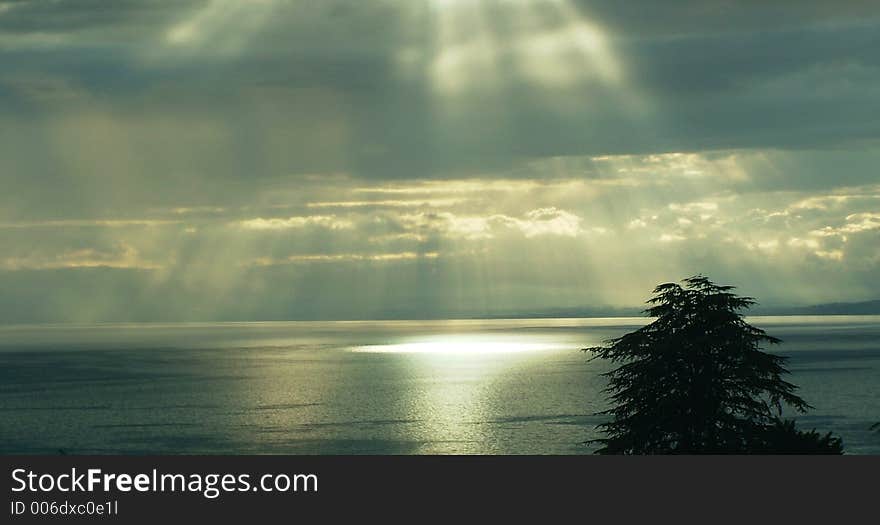 Sun through the clouds over Leman Lake, Switzerland. Sun through the clouds over Leman Lake, Switzerland