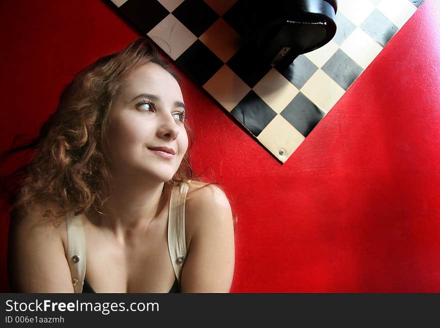 Happy smiling girl on red