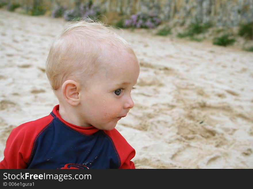 Small child exploring a beach in Cornwall. Small child exploring a beach in Cornwall.