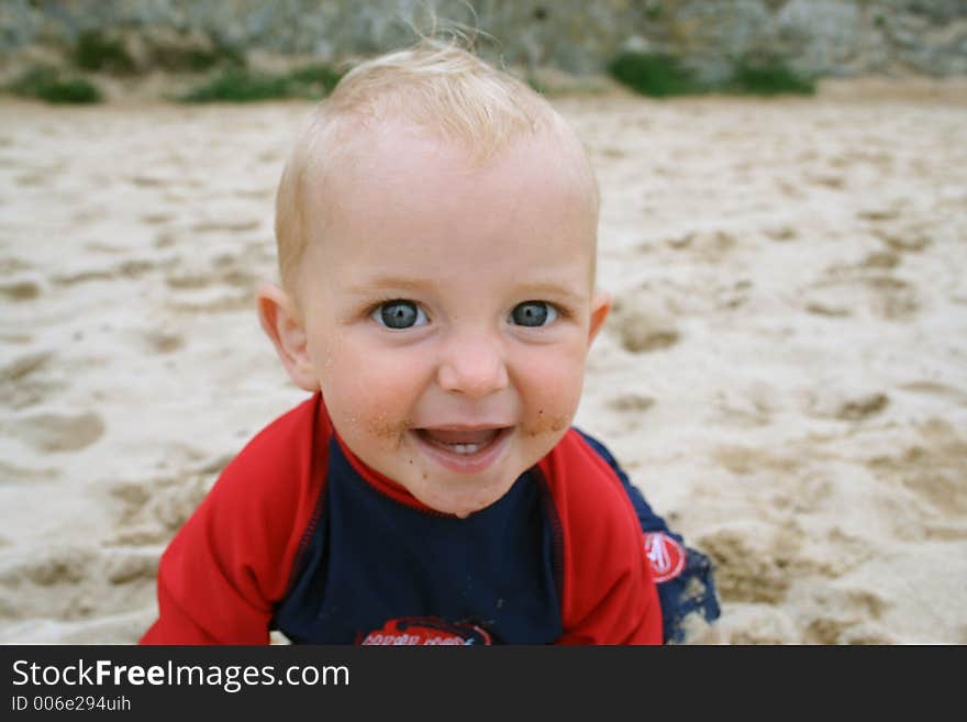 Small child exploring a beach in Cornwall. Small child exploring a beach in Cornwall.