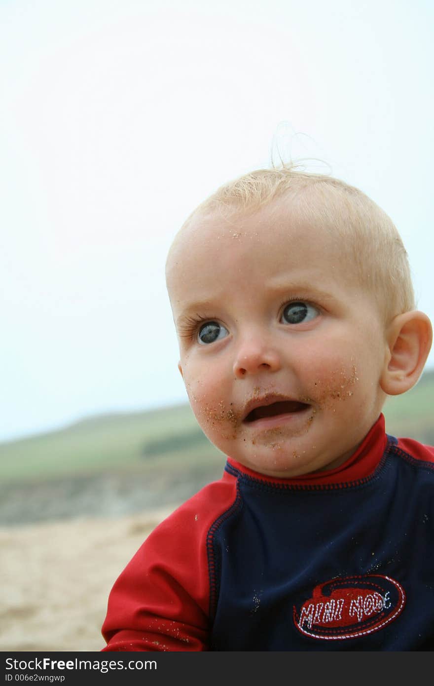 Small child exploring a beach in Cornwall. Small child exploring a beach in Cornwall.