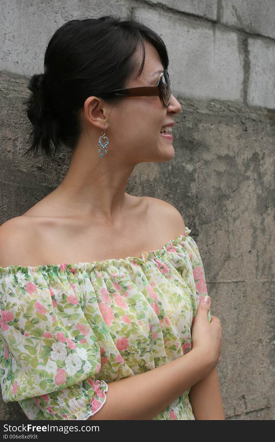 Side profile of a woman wearing big shades