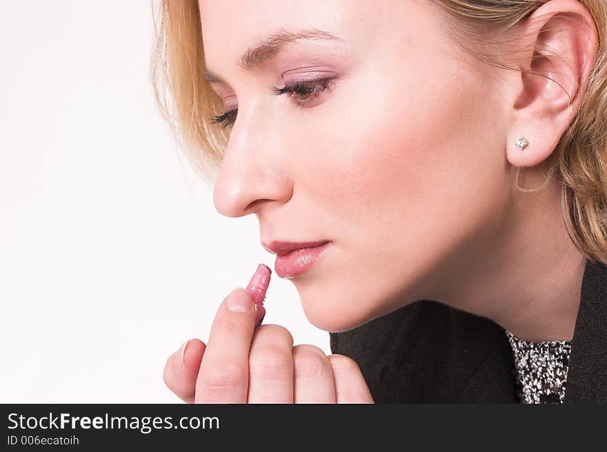 Model putting on makeup. Model putting on makeup