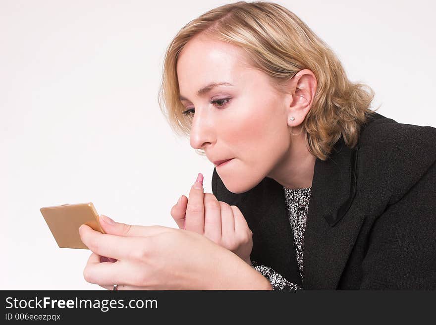 Model putting on makeup. Model putting on makeup