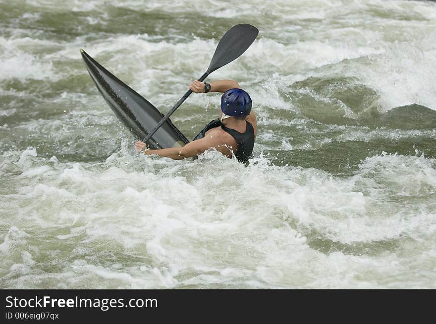 Adventurous Whitewater Kayaker in Rapids