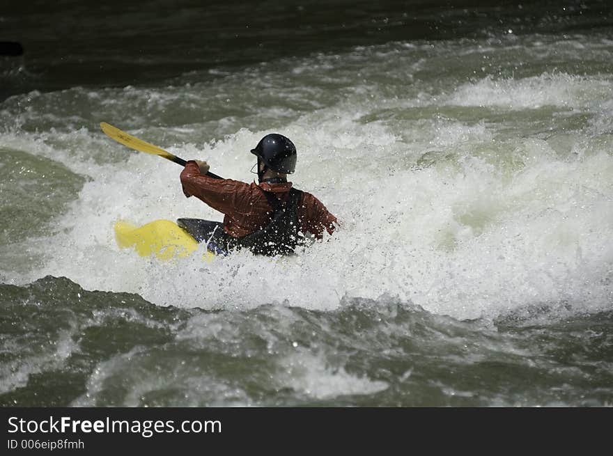 Adventurous Whitewater Kayaker in Rapids