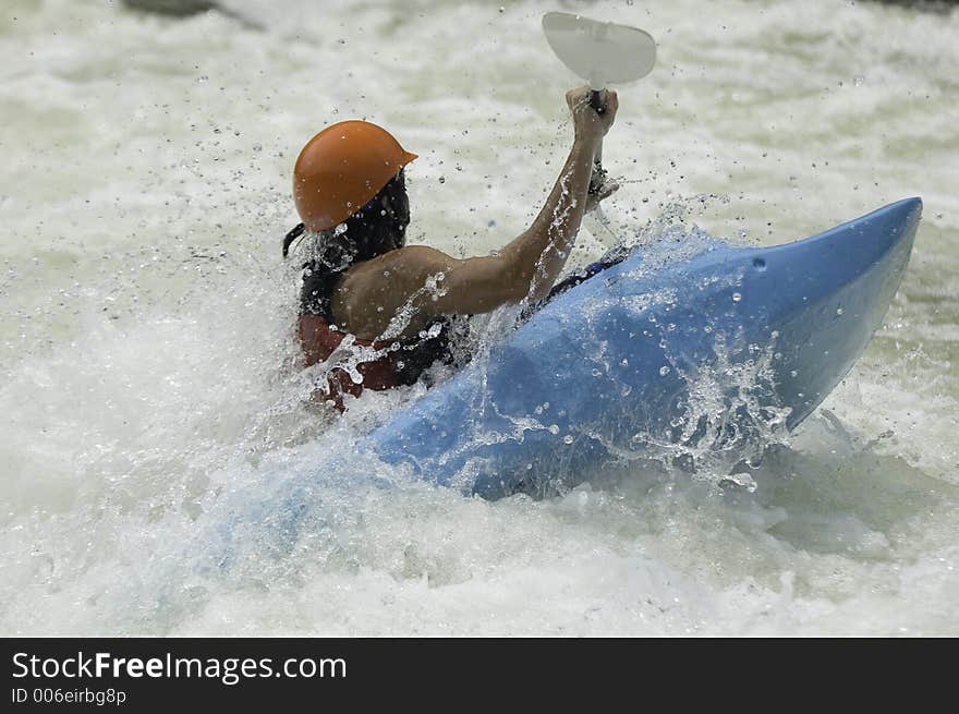 Adventurous Whitewater Kayaker in Rapids