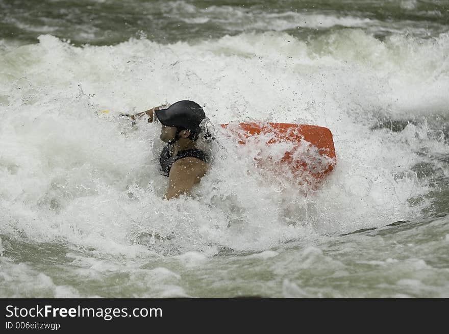 Adventurous Whitewater Kayaker in Rapids