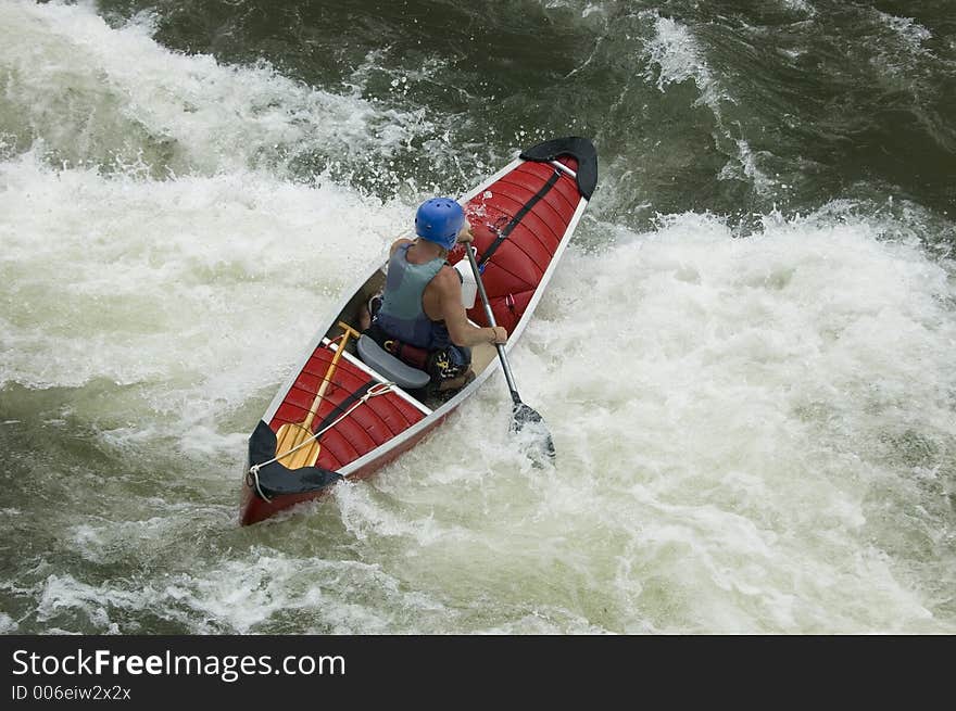 Adventurous Whitewater Kayaker in Rapids